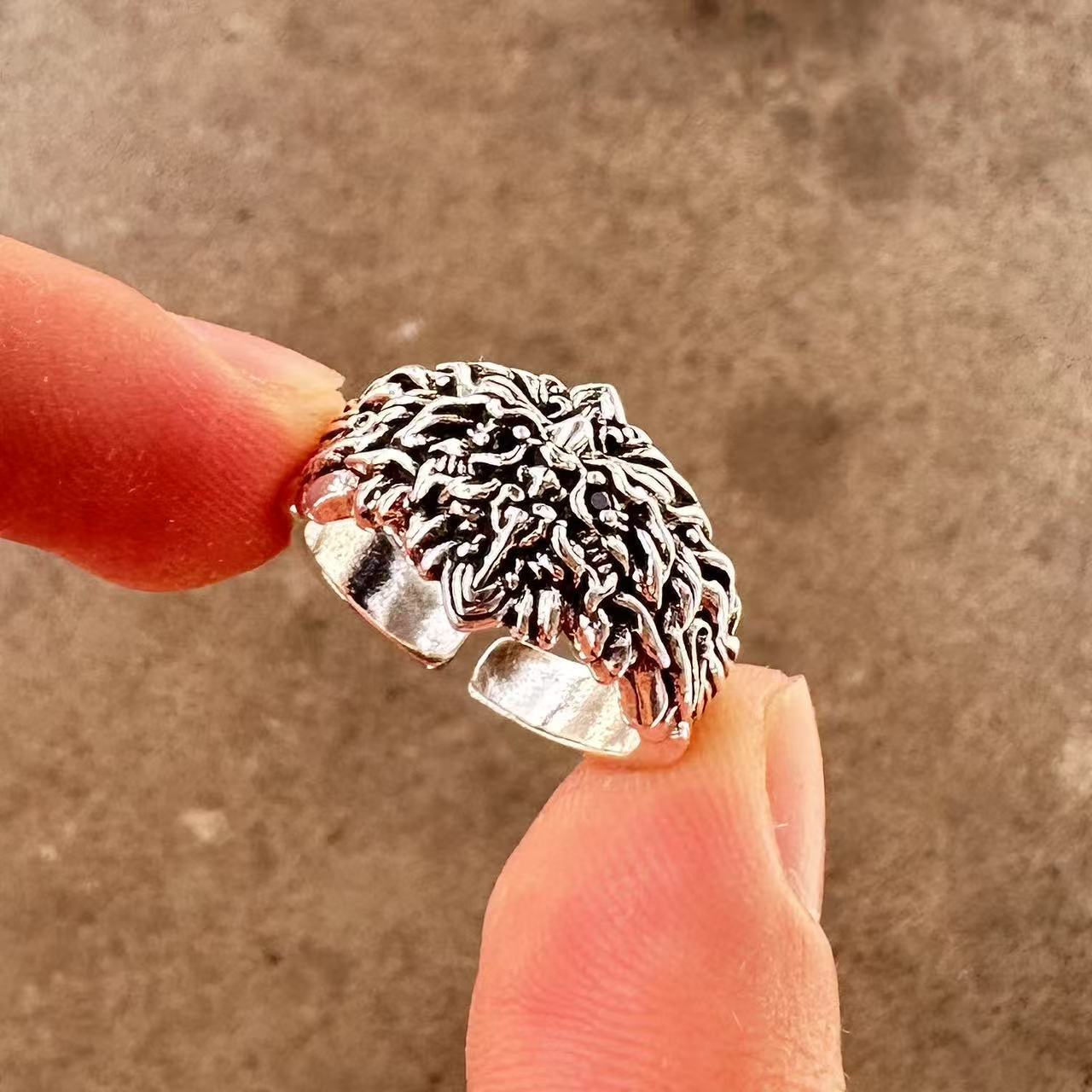 Men's ring with adjustable wide face opening